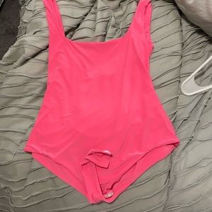 neon pink body suit from pretty little thing